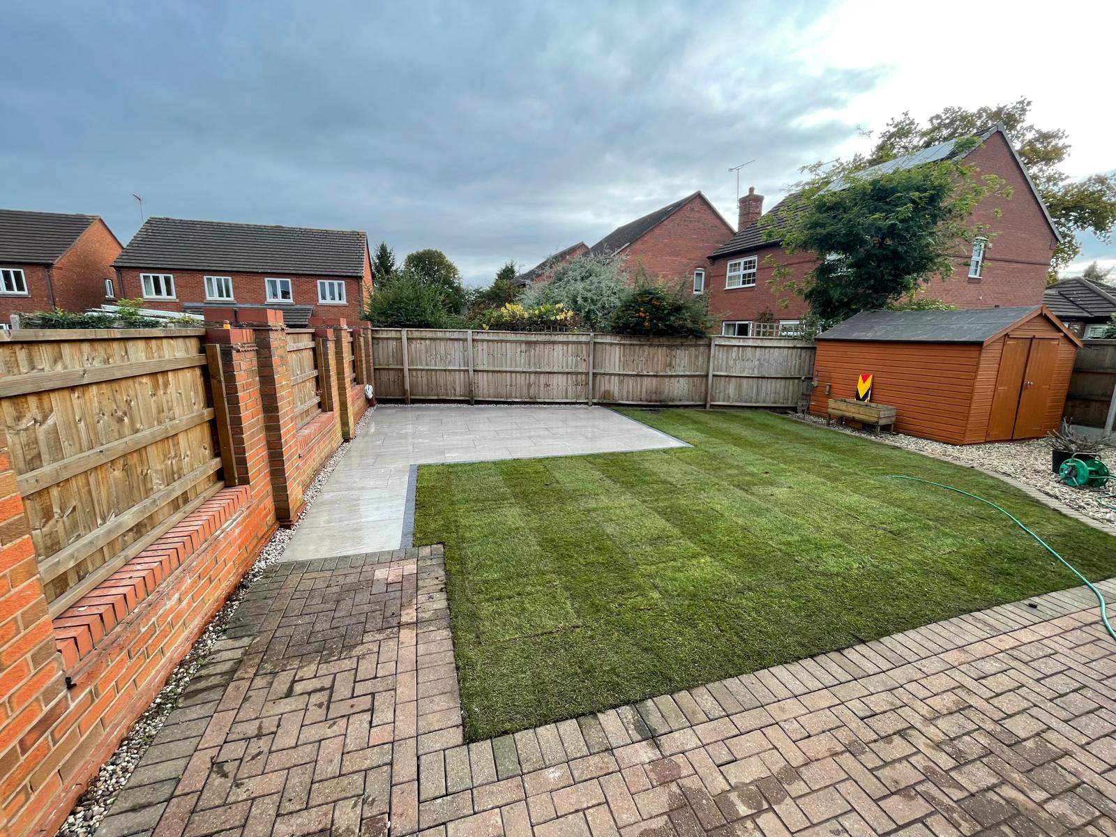 Fence line around a finished lawn project photo